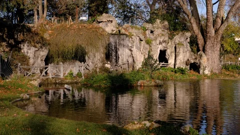 A small decorative waterfall in the Park or in the garden. Landscape design. Stock Footage 123163868