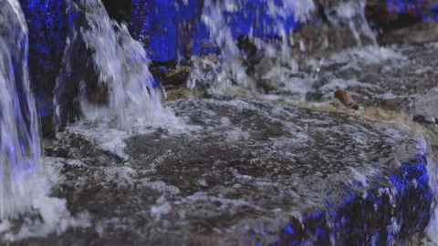 A small decorative waterfall in the Park or in the garden. Landscape design.Slow Video stock 154057432