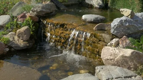 A small decorative waterfall with stones. Video stock 80721071