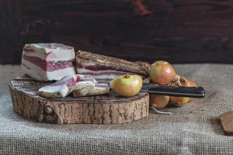 Small depth of field. lard layer sprinkled with spices on top. next to the on Foto stock