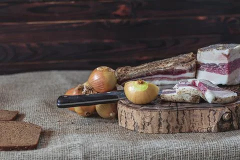 Small depth of field. lard layer sprinkled with spices on top. next to the on Stock Photos