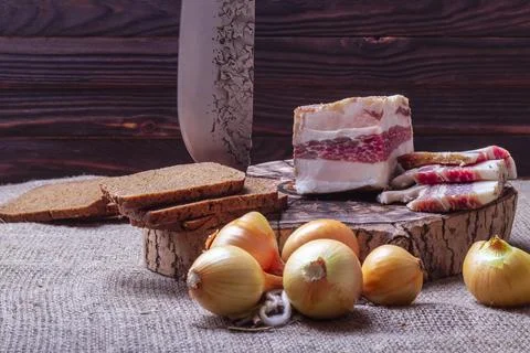 Small depth of field. lard layer sprinkled with spices on top. next to the on Stock Photos