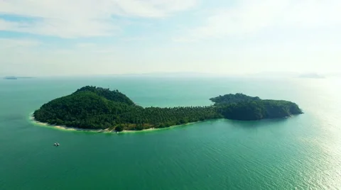 A small desert island with a particular form. Aerial video, the drone moves away Stock Footage 64850091