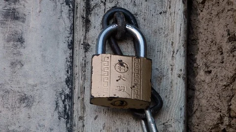 Small designs on old rusty gold lock. Stock-Footage 106321948