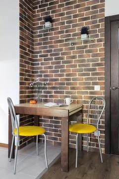 Small dining table and two chairs Stock Photos