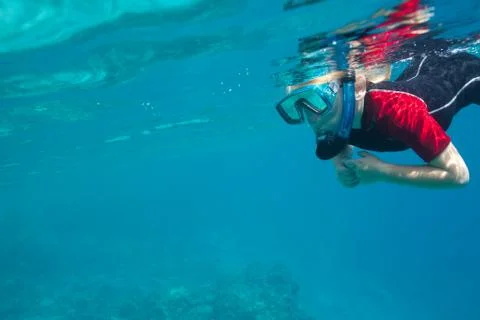 Small diver underwater Stock Photos