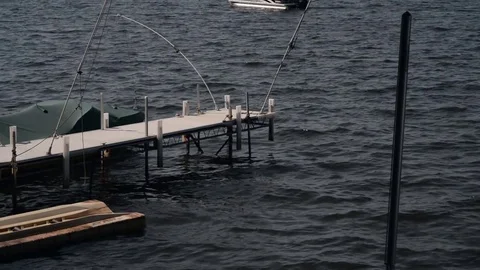 Small dock with choppy water Stock Footage 79792142