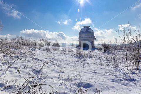 Small dome of the telescope at the Shemakha Observatory in winter Stock Photos
