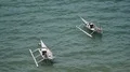 Small domestic traditional indonesia boats anchored on sea near coast 4k or 4k+ Resolution