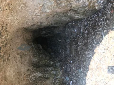 Small door of a small cave Stock Photos