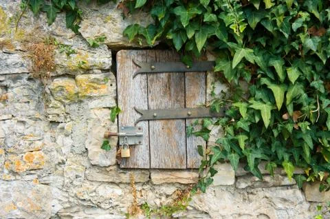 Small door in wall Stock Photos