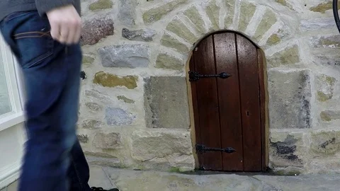 Small door in a wall, Skipton, UK Stock Footage