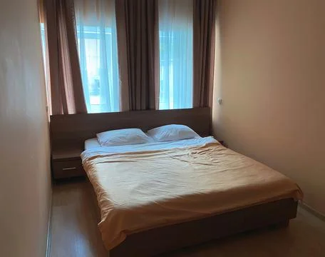 Small double room in the hotel with a small area in beige colors with a doubl Stock Photos