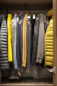 A small dressing room in the man's apartment. Fashionable men's clothes in ne Stock Photos