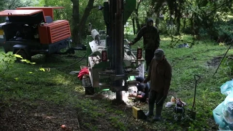 Small drilling rig   drilling water well for the country house. Stockbeeldmateriaal 219260329