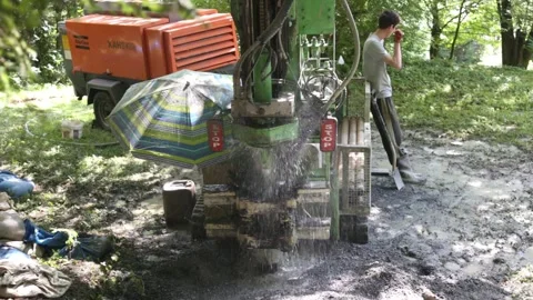 Small drilling rig   drilling water well for the country house. Stockbeeldmateriaal 219260677