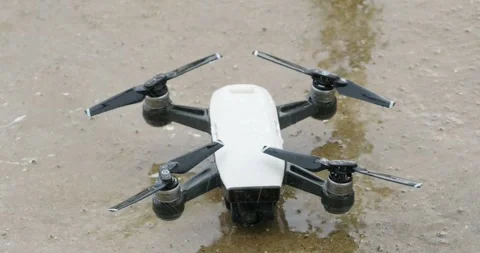 Small drone copter during rain Stock Footage 247273730