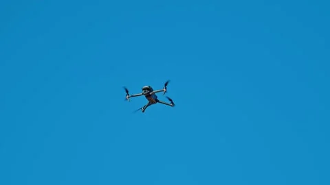 A small drone is flying in the sky Stock Footage 320434799