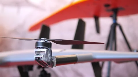 Small drone is sitting on a tripod Stock Footage 310490659