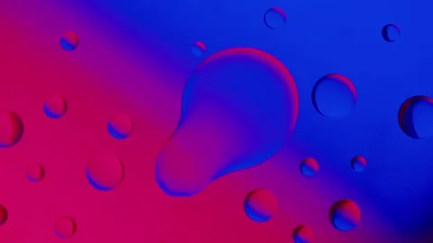 A small drop connects with a large drop on a blue-red gradient background Vídeo Stock 303058782