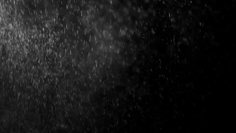 Small drops of rain, snow on a black background. wind Stock Footage 249999959