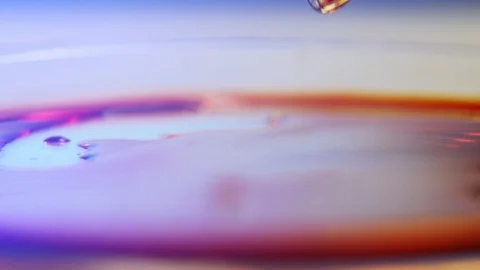 Small drops of red blood falling from a glassy tube on a round sauce with blood Stock-Footage 127216206