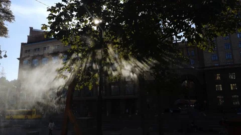 Small drops of water create an artificial fog that cools on hot days. Light pass Stock Footage 116340149