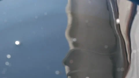 Small drops of water falling into a Full Barrel of Water Stock Footage 145408192