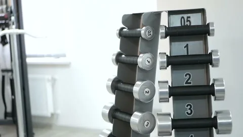 Small dumbbells in the gym, close-up  Video stock 88065050
