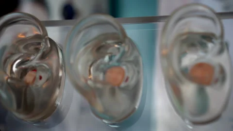 Small in-ear Hearing tool aid eqiupment for hearing impairment or hearing los Vídeos de archivo 165800902