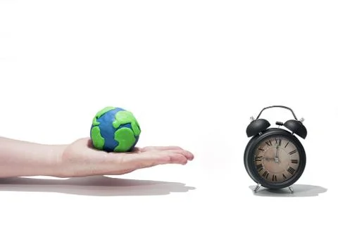 Small Earth model with human hands. Stock Photos