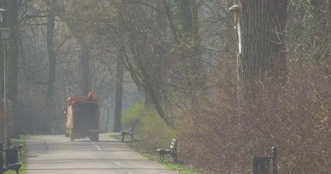 The Small Electric Garbage Truck Goes on Road Stock Footage 61897331