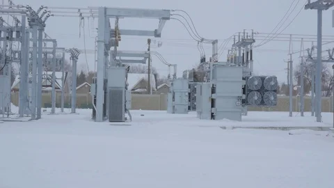 Small electrical substation in a light snow storm Видео 74649373