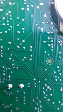 Small Electronic Board Showcasing Intricate Circuit Connections and Solder .. Stock Photos