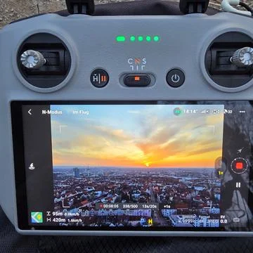 A small electronic FPV remote control device featuring the letters cns on it Stock Photos