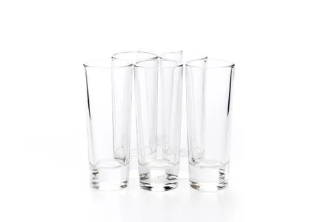 Small empty glasses on a white background - Image Stock Photos