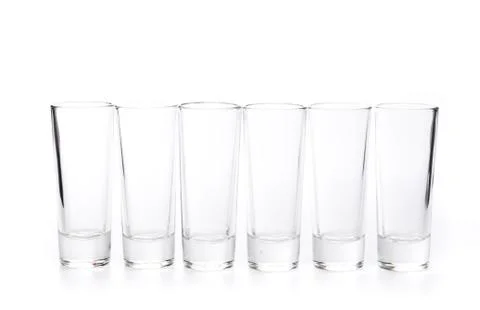 Small empty glasses on a white background - Image Stock Photos