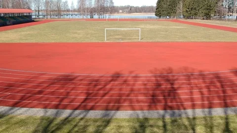 In small empty province stadium drone flying above football gate and  field 库存影片 87919696