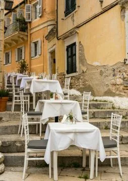 Small empty taverna in Old Town Corfu Stock Photos