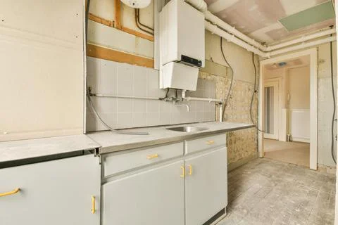 Small emty kitchen with balcony door Stock Photos