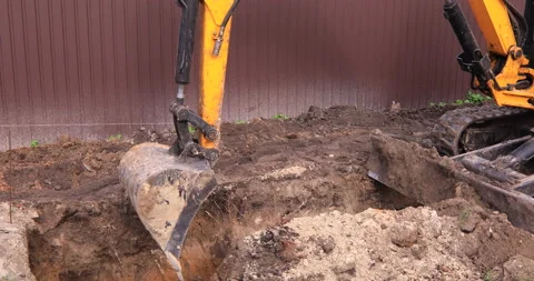 Small excavator working on a construction site. Construction works. Stock Footage 152506959