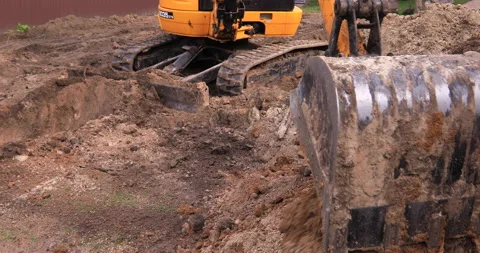 Small excavator working on a construction site. Construction works. Stock Footage 152507085