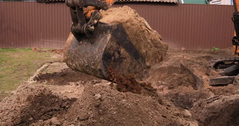 Small excavator working on a construction site. Construction works. Stock Footage 152507250