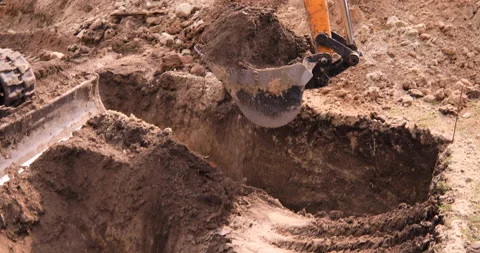 Small excavator working on a construction site. Construction works. Stock Footage 152507528