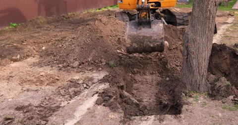 Small excavator working on a construction site. Construction works. Stock Footage 168188757