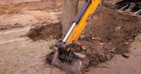 Small excavator working on a construction site. Construction works. Stock Footage 168189035