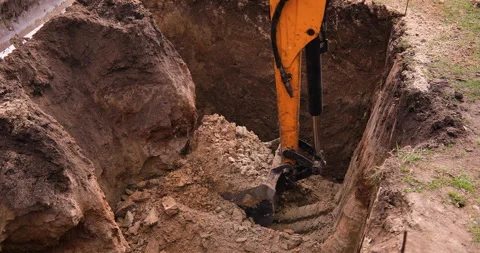 Small excavator working on a construction site. Construction works. Stock Footage 168190182