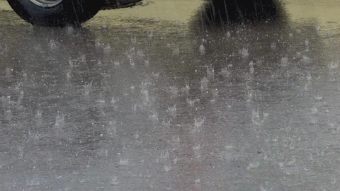 Small falling and jumping hail on the roadway near the car Stock Footage 126826485