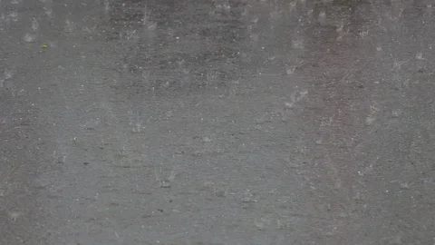 Small falling and jumping hail on the roadway near the car Stock Footage 126826555