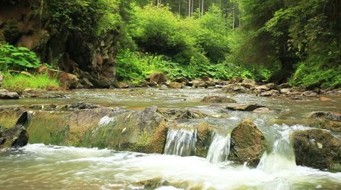 Small falls in the mountain river  close up. Sound Stockbeeldmateriaal 41727623